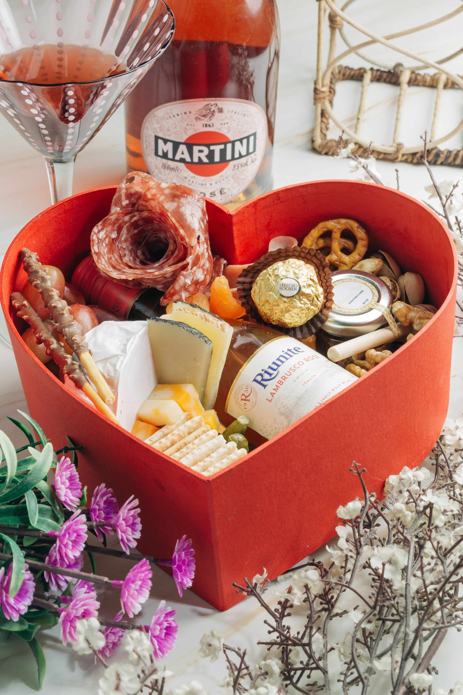 Colorful celebration hamper wrapped with a golden ribbon