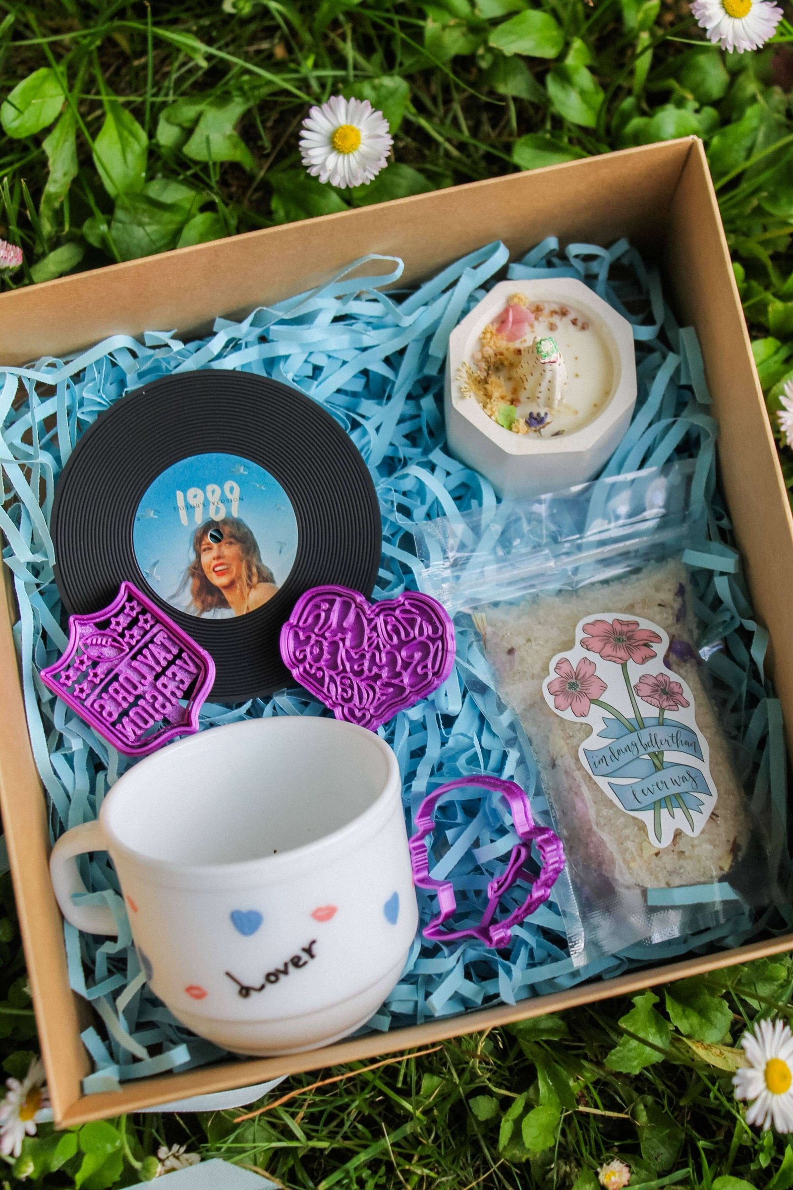 Layered gift collection with flowers and natural textures